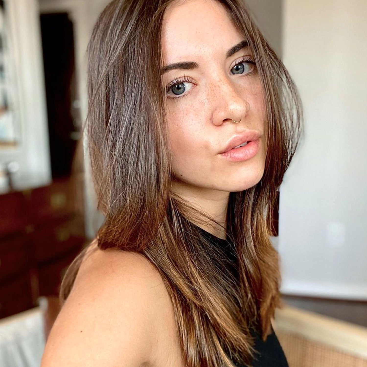 warm brown hair color on person with medium length hair