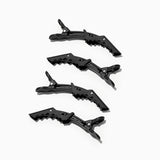 four black crocodile hair clips on the side