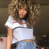 person with curly highlighted hair after wearing the remedy hair mask for fine hair