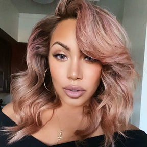 person with rose gold hair color on blonde, shoulder length pre-lightened hair