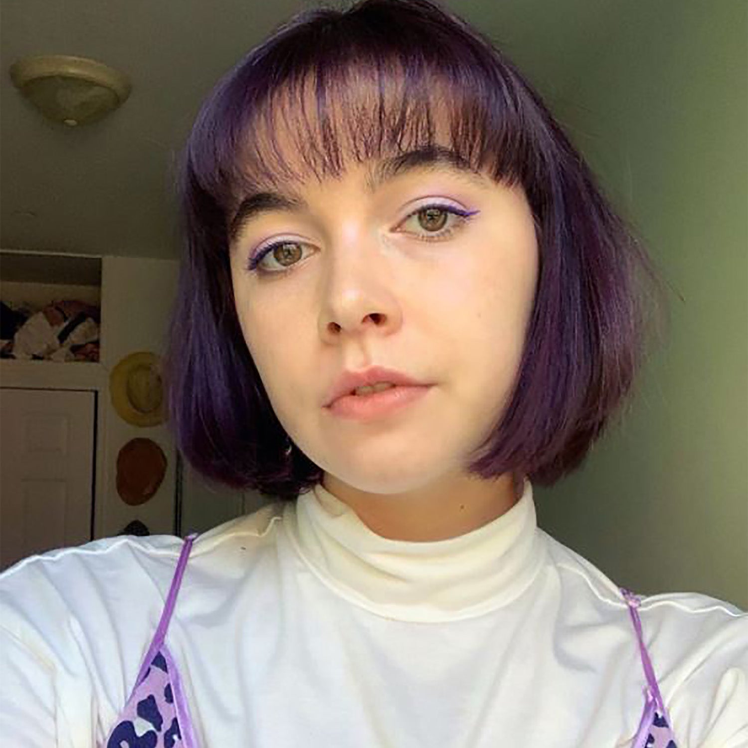 amethyst purple hair color on person with short brown hair